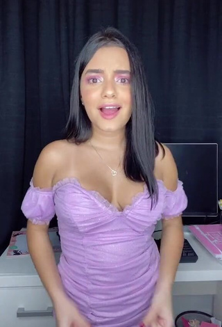 1. Erotic Bela Almada Shows Cleavage in Purple Dress