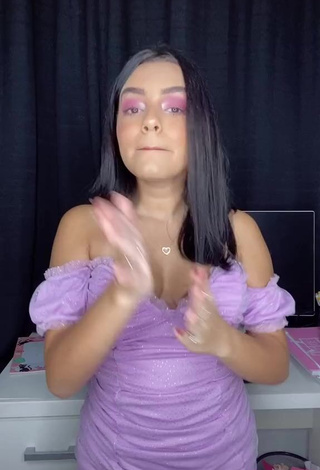 Erotic Bela Almada Shows Cleavage in Purple Dress