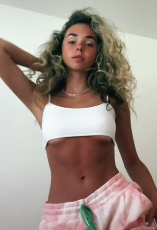 1. Captivating Chrissy Corsaro in White Crop Top (Underboob)