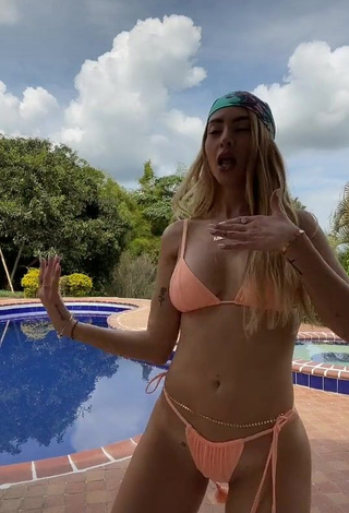 Captivating Dani Duke in Peach Bikini at the Pool