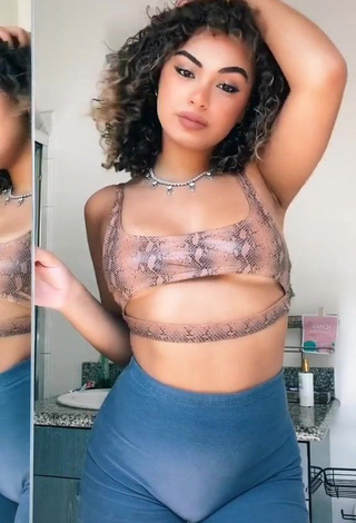 1. Sexy Devenity Perkins Shows Cleavage in Snake Print Crop Top (Underboob)