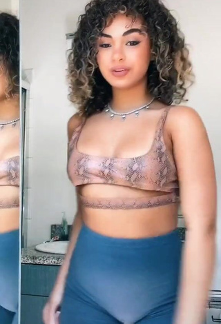 Sexy Devenity Perkins Shows Cleavage in Snake Print Crop Top (Underboob)