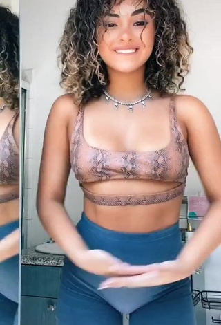 3. Sexy Devenity Perkins Shows Cleavage in Snake Print Crop Top (Underboob)