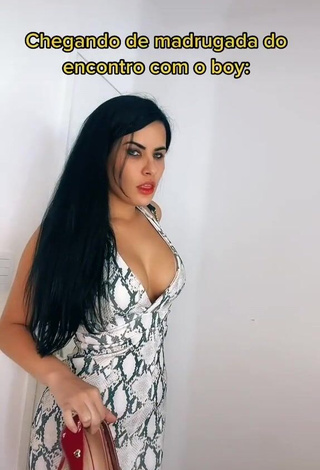 Cute Dine Azevedo Shows Cleavage in Snake Print Dress