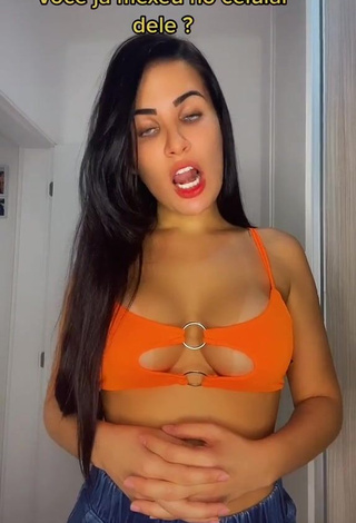 1. Captivating Dine Azevedo Shows Cleavage in Orange Crop Top