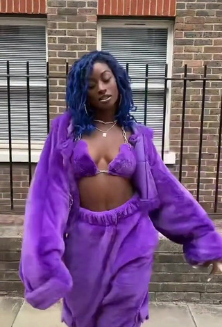 1. Erotic Oluwanifewa Agunbiade Shows Cleavage in Violet Bikini Top in a Street