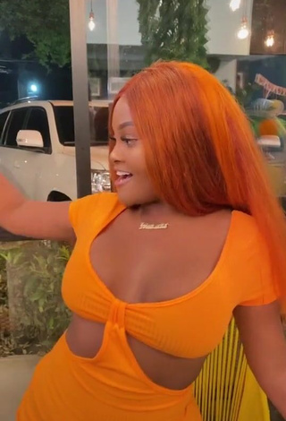 Irresistible Lajesuu Shows Cleavage in Orange Dress