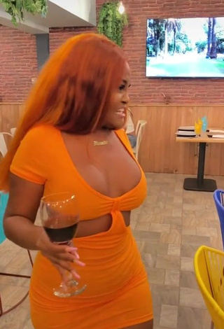 1. Erotic Lajesuu Shows Cleavage in Orange Dress