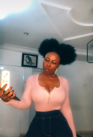 1. Irresistible Lilly Chioma Shows Cleavage in Pink Top