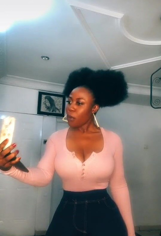 Irresistible Lilly Chioma Shows Cleavage in Pink Top