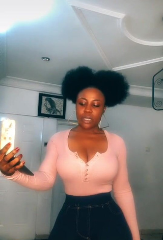 3. Irresistible Lilly Chioma Shows Cleavage in Pink Top