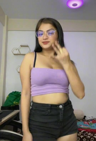 Erotic Marylaine Amahit Shows Cleavage in Purple Crop Top