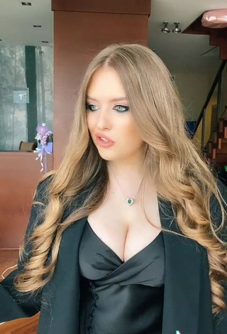 3. Erotic Viktoria Nikulina Shows Cleavage in Black Dress