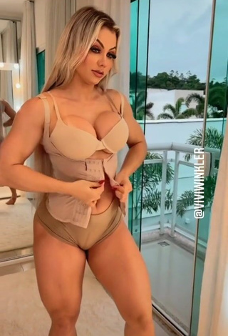 Erotic Vivi Winkler Shows Cleavage in Beige Bra