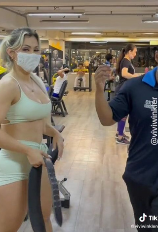 Cute Vivi Winkler Shows Cleavage in Crop Top in the Sports Club