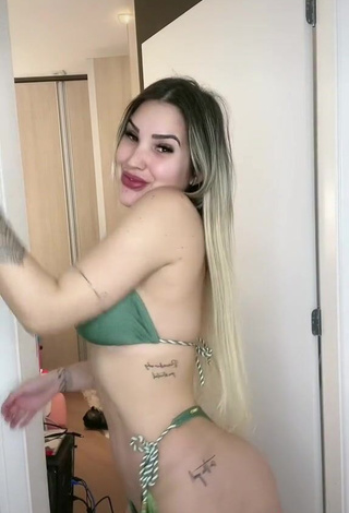 3. Erotic Alannis Proença Shows Cleavage in Green Bikini