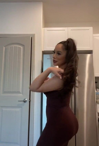 2. Erotic Alondra Ortiz Shows Cleavage in Brown Dress