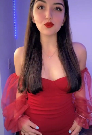 Irresistible Andyy Tok Shows Cleavage in Red Dress