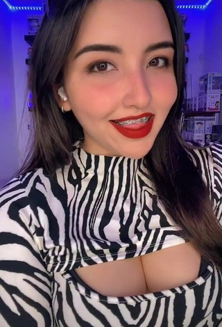 1. Captivating Andyy Tok Shows Cleavage in Zebra Dress