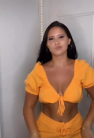 Hot Anissa Shows Cleavage in Orange Crop Top