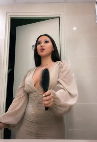 Captivating Anissa Shows Cleavage in Dress (Side Boob)