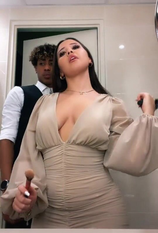 3. Captivating Anissa Shows Cleavage in Dress (Side Boob)