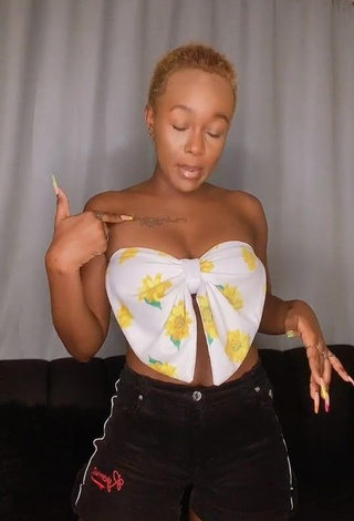 Erotic Azziad Nasenya Shows Cleavage in Floral Tube Top