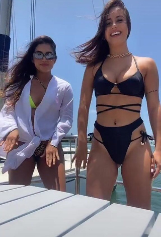 Sweetie Bianca Jesuino Shows Cleavage in Black Bikini on a Boat