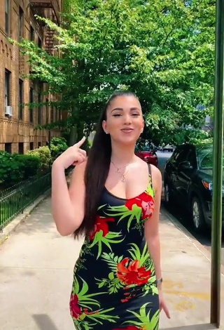 1. Erotic Enisa Shows Cleavage in Floral Dress in a Street