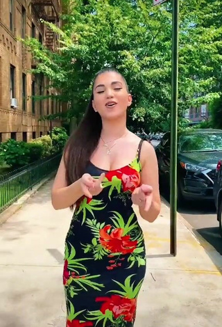 2. Erotic Enisa Shows Cleavage in Floral Dress in a Street