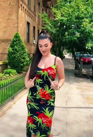 3. Erotic Enisa Shows Cleavage in Floral Dress in a Street