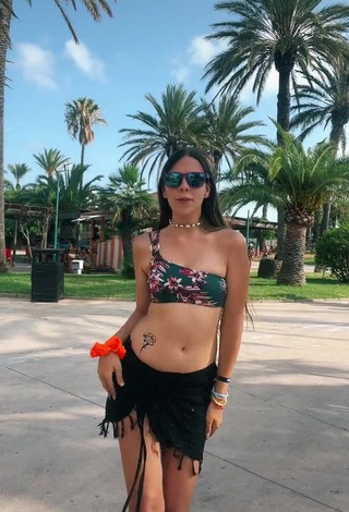 1. Beautiful Esther Martinez Shows Cleavage in Sexy Floral Bikini Top