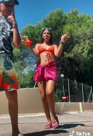 3. Sweetie Esther Martinez Shows Cleavage in Orange Bikini Top