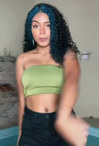 Erotic Radija Pereira Shows Cleavage in Olive Tube Top