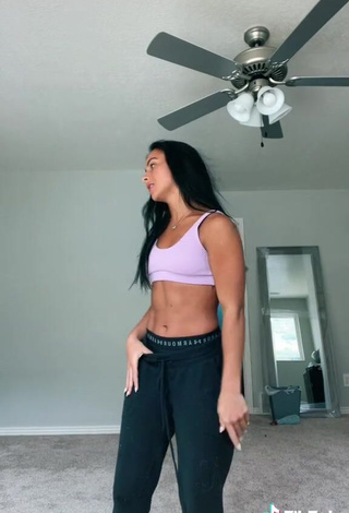 Captivating Gabi Butler Shows Cleavage in Violet Sport Bra