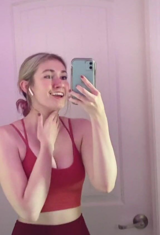 Irresistible Sydney Shows Cleavage in Red Crop Top