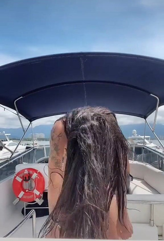 Captivating Pamella Fuego Shows Cleavage in Leopard Bikini on a Boat