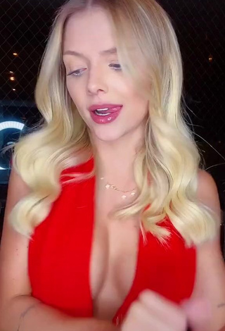 2. Erotic Carol Bresolin Shows Cleavage in Red Top