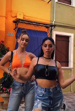 1. Sweetie Carla Flila Shows Cleavage in Orange Crop Top