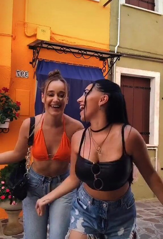 3. Sweetie Carla Flila Shows Cleavage in Orange Crop Top