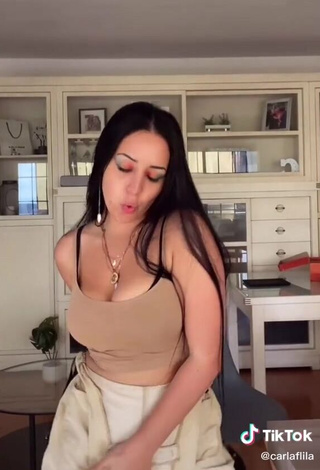 Irresistible Carla Flila Shows Cleavage in Beige Top