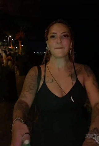 3. Erotic ingizem34 Shows Cleavage in Black Dress in a Street