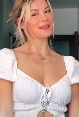 3. Pretty Iryna Zubkova Shows Cleavage in White Crop Top