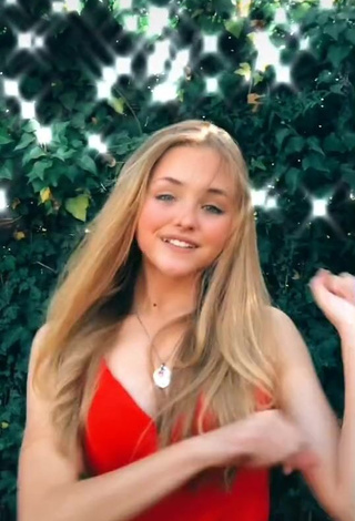 3. Erotic Bella Messens Shows Cleavage in Red Dress