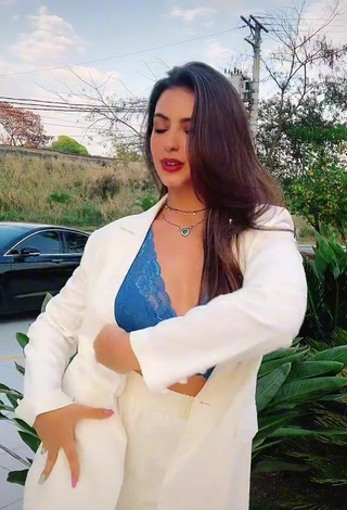 Erotic Isa Pinheiro Shows Cleavage in Blue Bra in a Street