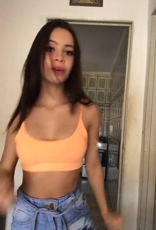 Fine Carol Nunes Shows Cleavage in Sweet Peach Crop Top