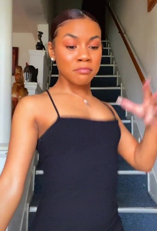 3. Erotic Kristen Ware Shows Cleavage in Black Dress
