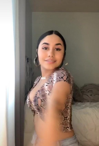 3. Irresistible Iya Madrid Shows Cleavage in Snake Print Crop Top (Side Boob)