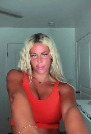 1. Erotic Tiffany Jeffcoat Shows Cleavage in Orange Sport Bra