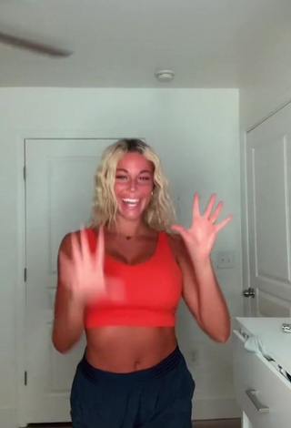Erotic Tiffany Jeffcoat Shows Cleavage in Orange Sport Bra
